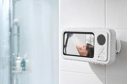 AquaSound mounted on the shower wall playing a video